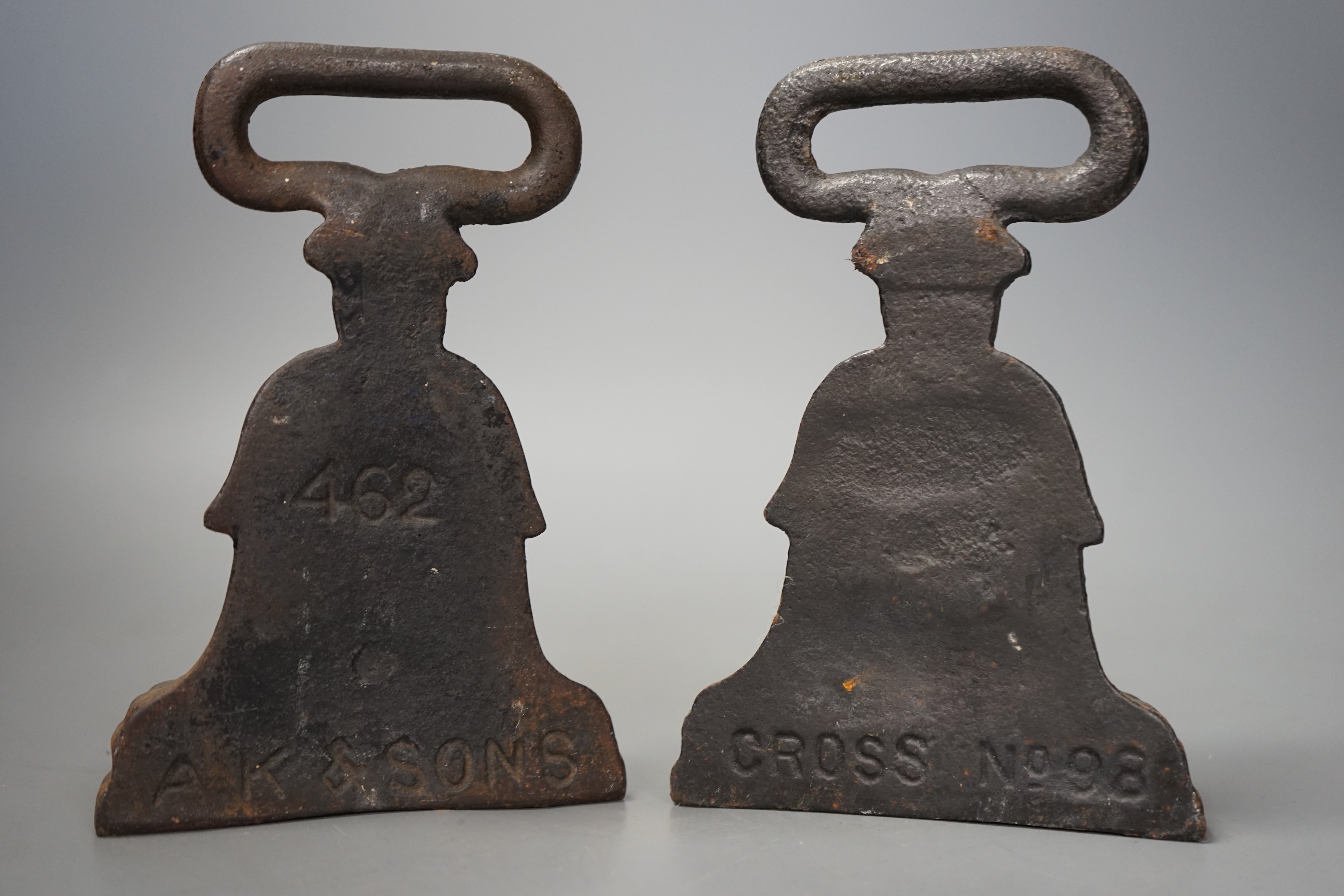 Two decorative matched pair Victorian cast iron doorstops, tallest 18cm